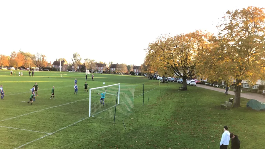 Football on the Green under autumn trees
