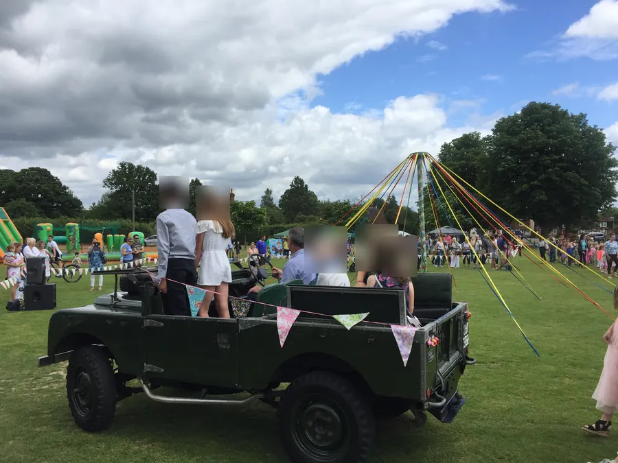 Maypole dancing and a vintage Land Rover at the village fete on the Green
